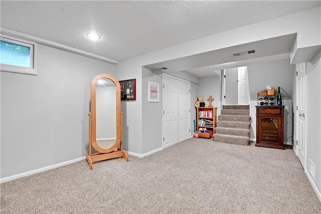6016 W 85th St, Overland Park, KS 66207 - basement with a textured ceiling, carpet flooring, baseboards, and stairs
