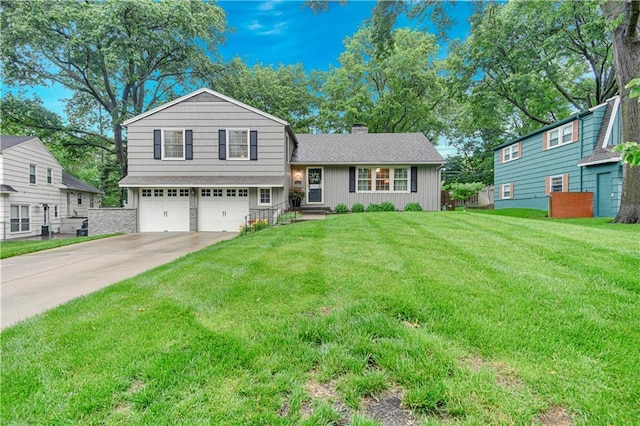 6016 W 85th St, Overland Park, KS 66207 - split level home with a garage, a chimney, concrete driveway, a front yard, and roof with shingles