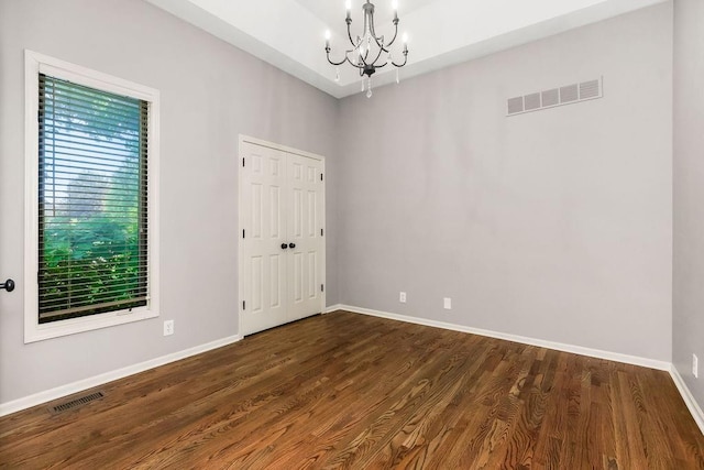 5408 W 153rd St, Leawood, KS 66224 - spare room featuring a chandelier, baseboards, and dark wood-style flooring