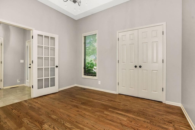 5408 W 153rd St, Leawood, KS 66224 - foyer entrance with wood finished floors, a chandelier, and baseboards