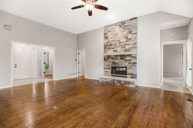 5408 W 153rd St, Leawood, KS 66224 - unfurnished living room with ceiling fan, a stone fireplace, wood finished floors, and baseboards