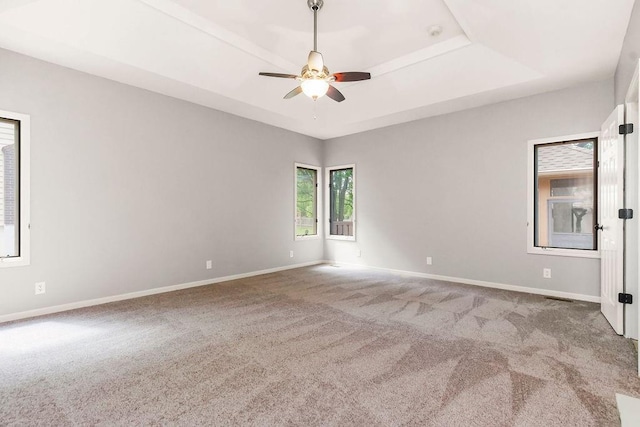5408 W 153rd St, Leawood, KS 66224 - empty room with carpet floors, ceiling fan, a raised ceiling, and baseboards