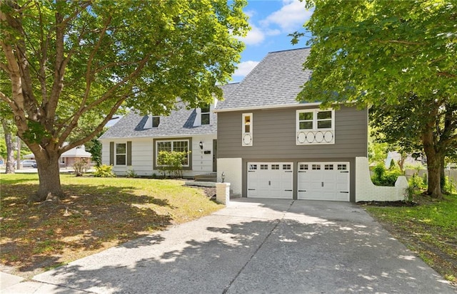 9501 Glenwood St, Overland Park, KS 66212 - view of front of property with an attached garage, concrete driveway, a shingled roof, and brick siding
