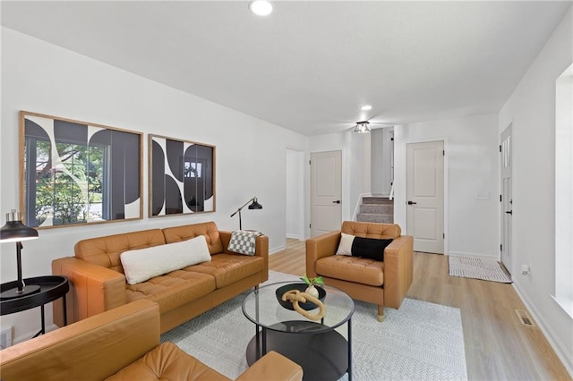 9501 Glenwood St, Overland Park, KS 66212 - living room with light wood-style flooring, baseboards, recessed lighting, and stairway
