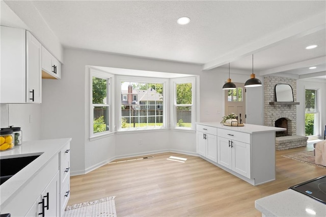 9501 Glenwood St, Overland Park, KS 66212 - kitchen featuring plenty of natural light, light countertops, beam ceiling, and recessed lighting