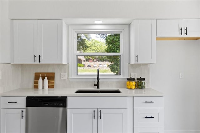 9501 Glenwood St, Overland Park, KS 66212 - kitchen featuring stainless steel dishwasher, a sink, light countertops, and decorative backsplash