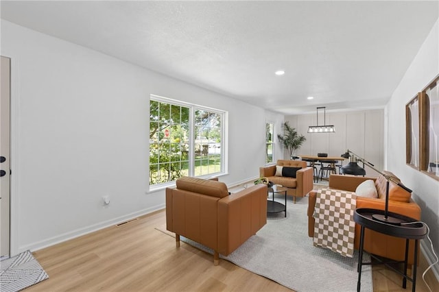 9501 Glenwood St, Overland Park, KS 66212 - living area with light wood-style flooring and recessed lighting