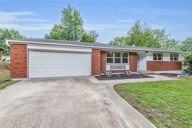 5005 S Grand Ave, Independence, MO 64055 - single story home featuring brick siding, concrete driveway, a garage, and a front lawn