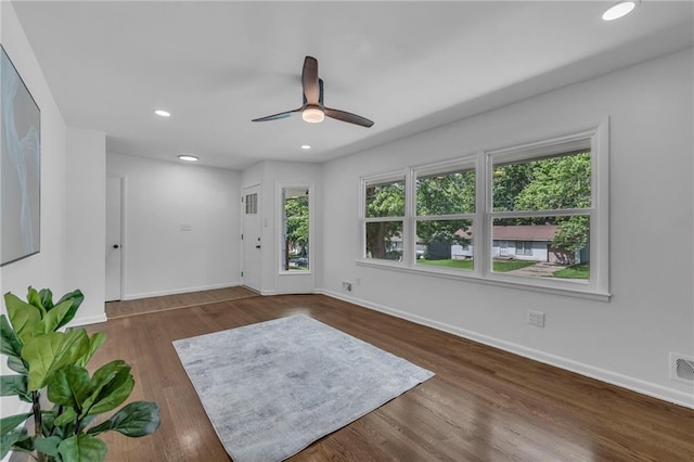 5005 S Grand Ave, Independence, MO 64055 - unfurnished room with a ceiling fan, baseboards, wood finished floors, and recessed lighting