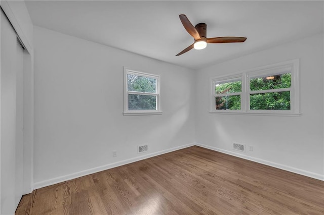 5005 S Grand Ave, Independence, MO 64055 - empty room featuring wood finished floors, baseboards, and ceiling fan