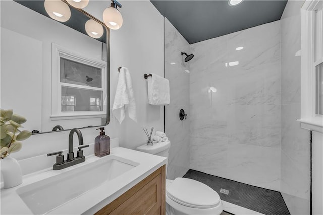 5005 S Grand Ave, Independence, MO 64055 - bathroom with vanity, toilet, and a tile shower