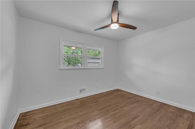 5005 S Grand Ave, Independence, MO 64055 - empty room featuring ceiling fan, wood finished floors, and baseboards