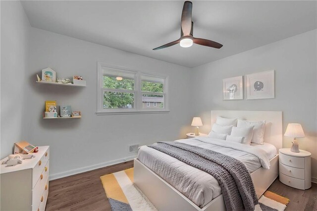 5005 S Grand Ave, Independence, MO 64055 - bedroom with wood finished floors, baseboards, and ceiling fan