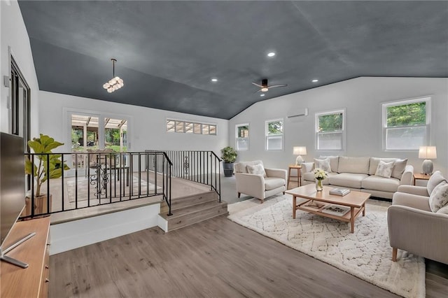 5005 S Grand Ave, Independence, MO 64055 - living area with vaulted ceiling, wood finished floors, ceiling fan, plenty of natural light, and recessed lighting