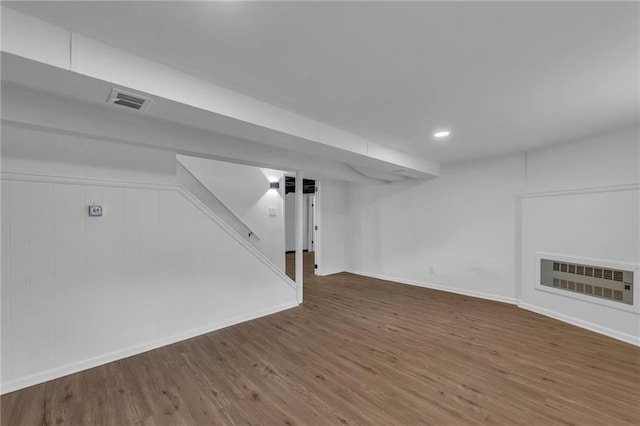 5005 S Grand Ave, Independence, MO 64055 - finished basement with wood finished floors, baseboards, recessed lighting, and stairs