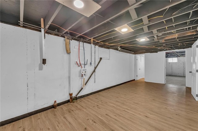 5005 S Grand Ave, Independence, MO 64055 - basement with wood finished floors