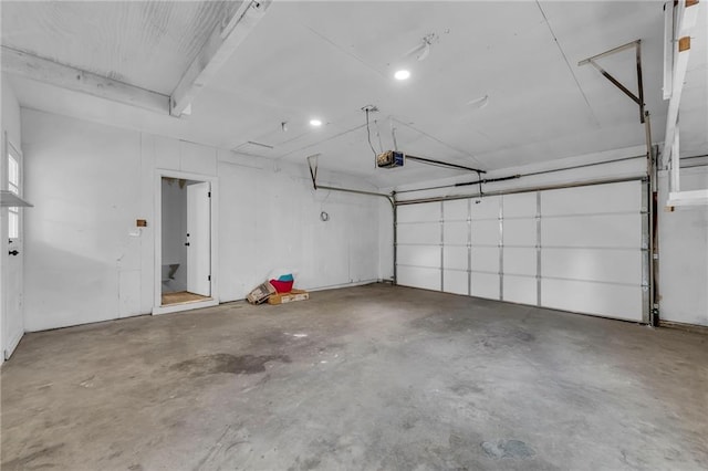 5005 S Grand Ave, Independence, MO 64055 - garage featuring a garage door opener