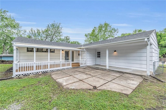 5005 S Grand Ave, Independence, MO 64055 - rear view of house featuring a porch