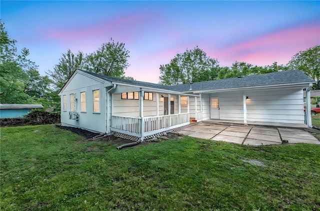 5005 S Grand Ave, Independence, MO 64055 - rear view of house with a patio and a yard