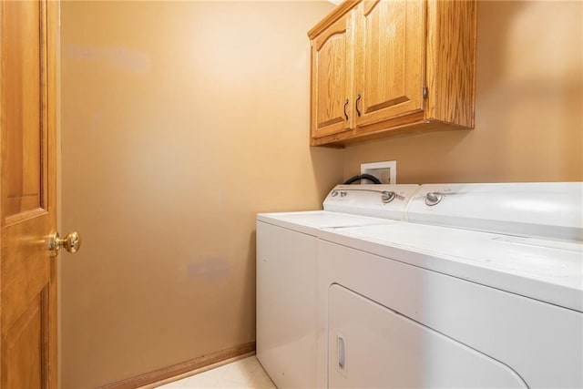 7504 N Palmer Ave, Kansas City, MO 64158 - laundry room featuring cabinet space and independent washer and dryer