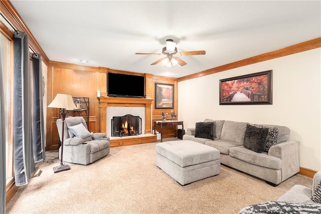 7504 N Palmer Ave, Kansas City, MO 64158 - carpeted living area with ornamental molding, a ceiling fan, and a large fireplace