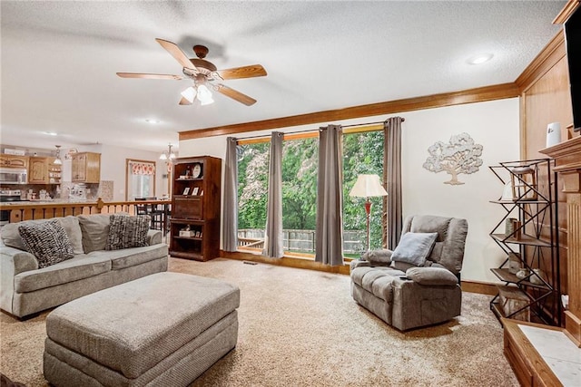 7504 N Palmer Ave, Kansas City, MO 64158 - living room featuring light carpet, a ceiling fan, ornamental molding, a textured ceiling, and recessed lighting