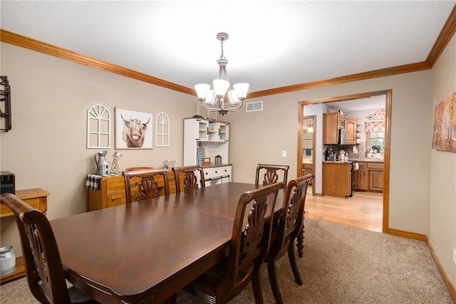 7504 N Palmer Ave, Kansas City, MO 64158 - dining room featuring a chandelier, ornamental molding, light colored carpet, and baseboards