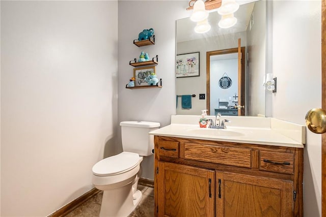 7504 N Palmer Ave, Kansas City, MO 64158 - bathroom featuring vanity, baseboards, and toilet