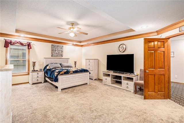 7504 N Palmer Ave, Kansas City, MO 64158 - bedroom with a tray ceiling, carpet, baseboards, a textured ceiling, and a ceiling fan