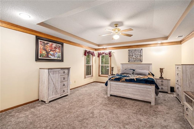 7504 N Palmer Ave, Kansas City, MO 64158 - bedroom with a tray ceiling, carpet flooring, baseboards, a textured ceiling, and ceiling fan