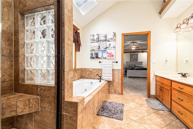 7504 N Palmer Ave, Kansas City, MO 64158 - ensuite bathroom featuring a whirlpool tub, vanity, tiled shower, tile patterned flooring, and ceiling fan