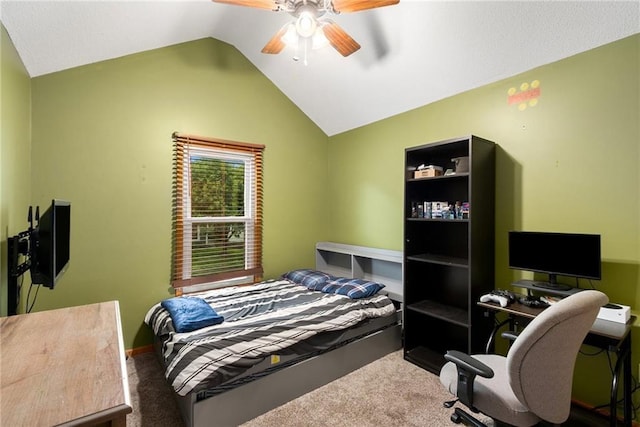 7504 N Palmer Ave, Kansas City, MO 64158 - carpeted bedroom with vaulted ceiling, ceiling fan, and a desk