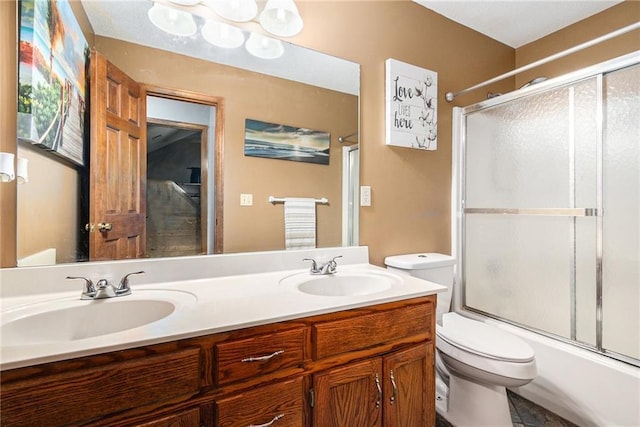 7504 N Palmer Ave, Kansas City, MO 64158 - full bath featuring toilet, double vanity, and combined bath / shower with glass door