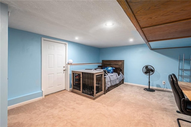 7504 N Palmer Ave, Kansas City, MO 64158 - bedroom with carpet floors, baseboards, recessed lighting, and a textured ceiling