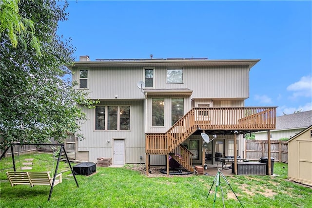 7504 N Palmer Ave, Kansas City, MO 64158 - back of property featuring stairway, a deck, a patio, and a chimney