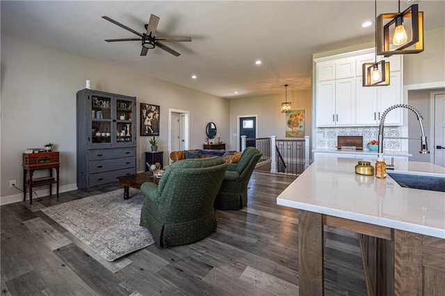 76 Casper St, Garden City, MO 64747 - living room with dark wood-style floors, recessed lighting, a ceiling fan, and baseboards