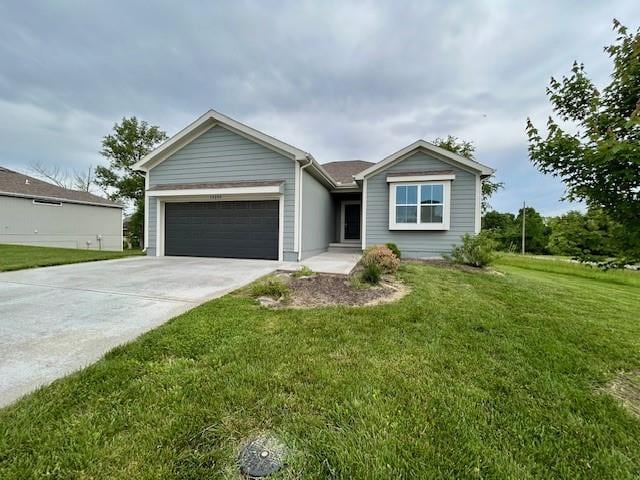 10204 Siena Dr, Peculiar, MO 64078 - ranch-style house with an attached garage, concrete driveway, and a front yard