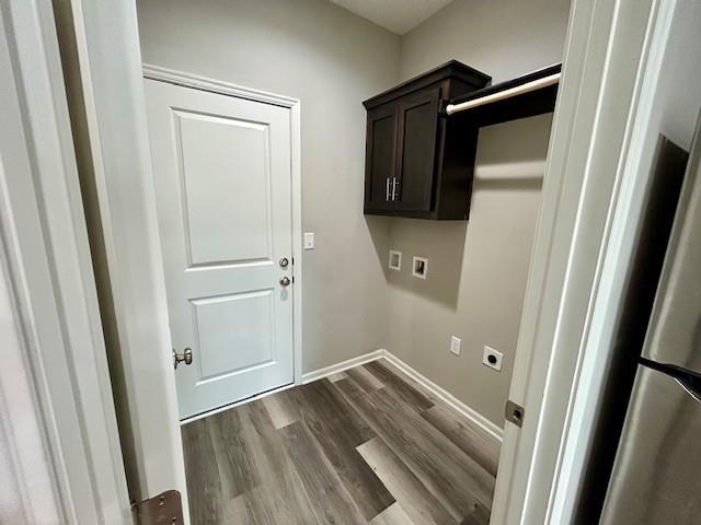 10204 Siena Dr, Peculiar, MO 64078 - laundry room with cabinet space, hookup for a washing machine, dark wood-style floors, electric dryer hookup, and baseboards
