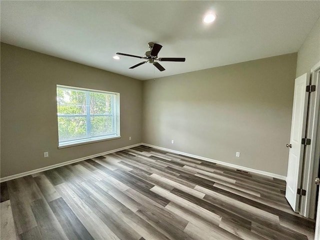 10204 Siena Dr, Peculiar, MO 64078 - empty room featuring ceiling fan, dark wood finished floors, baseboards, and recessed lighting