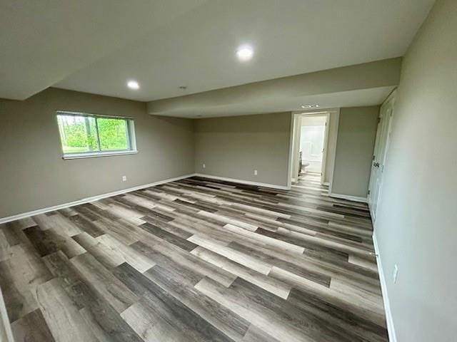 10204 Siena Dr, Peculiar, MO 64078 - spare room featuring baseboards, wood finished floors, and recessed lighting