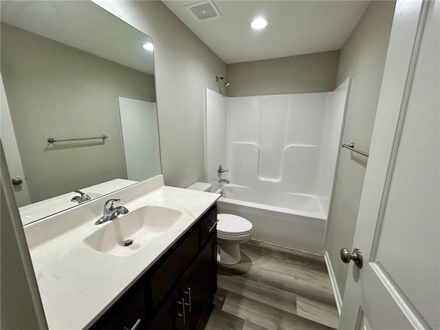 10204 Siena Dr, Peculiar, MO 64078 - full bath with toilet, vanity, wood finished floors, shower / tub combination, and recessed lighting