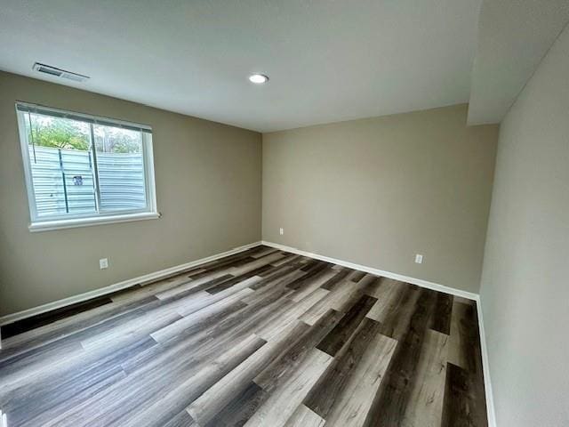 10204 Siena Dr, Peculiar, MO 64078 - empty room featuring dark wood-style floors, baseboards, and recessed lighting