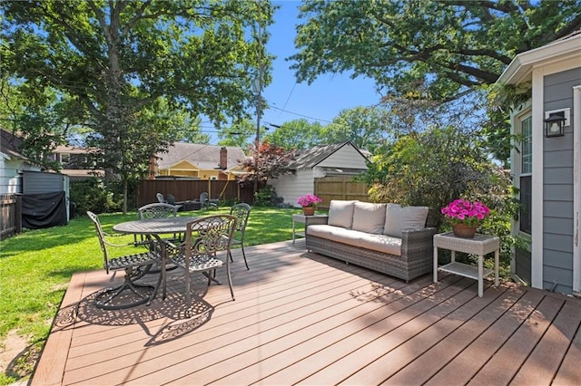 611 E 64th Ter, Kansas City, MO 64131 - wooden deck with a fenced backyard, outdoor lounge area, and outdoor dining space