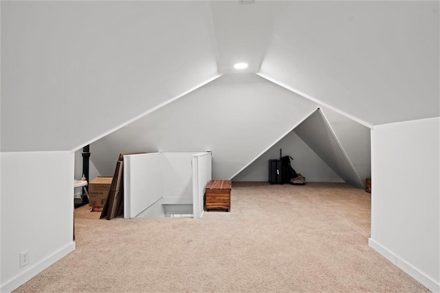 611 E 64th Ter, Kansas City, MO 64131 - additional living space with vaulted ceiling and carpet floors