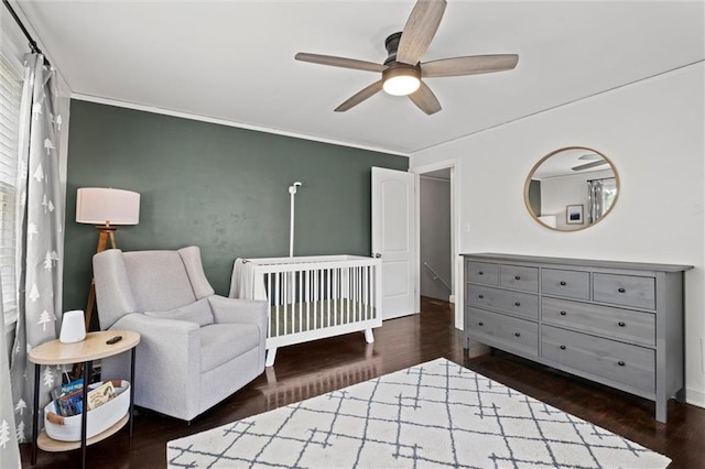 611 E 64th Ter, Kansas City, MO 64131 - bedroom with wood finished floors, crown molding, and a ceiling fan