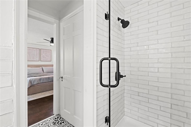 611 E 64th Ter, Kansas City, MO 64131 - ensuite bathroom featuring a stall shower and ceiling fan