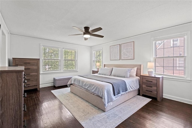 611 E 64th Ter, Kansas City, MO 64131 - bedroom featuring dark wood-type flooring, a textured ceiling, and ceiling fan