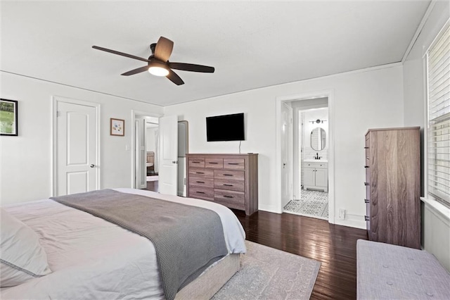 611 E 64th Ter, Kansas City, MO 64131 - bedroom featuring dark wood-style flooring, ceiling fan, and ensuite bathroom