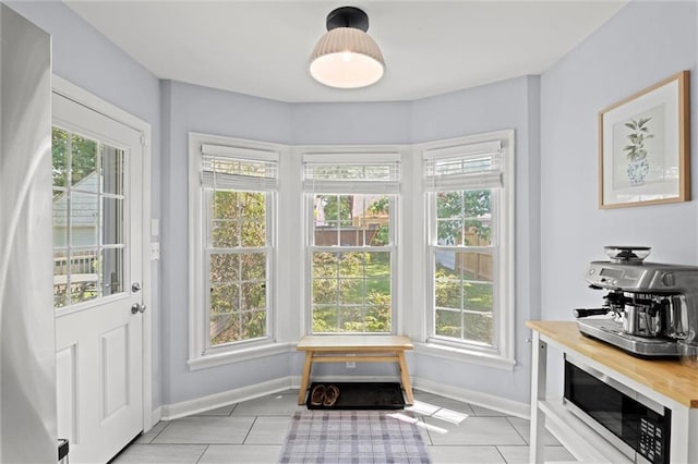 611 E 64th Ter, Kansas City, MO 64131 - entryway featuring light tile patterned floors and plenty of natural light