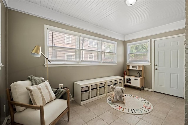 611 E 64th Ter, Kansas City, MO 64131 - rec room featuring light tile patterned floors and ornamental molding